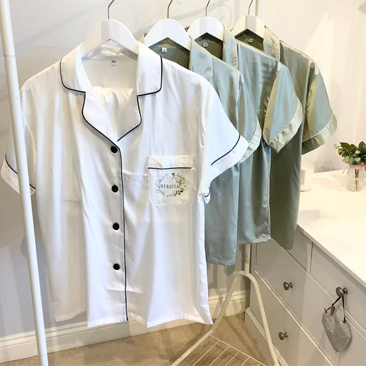 Set of pajama tops on hangers with a visible brand logo in a room setting.